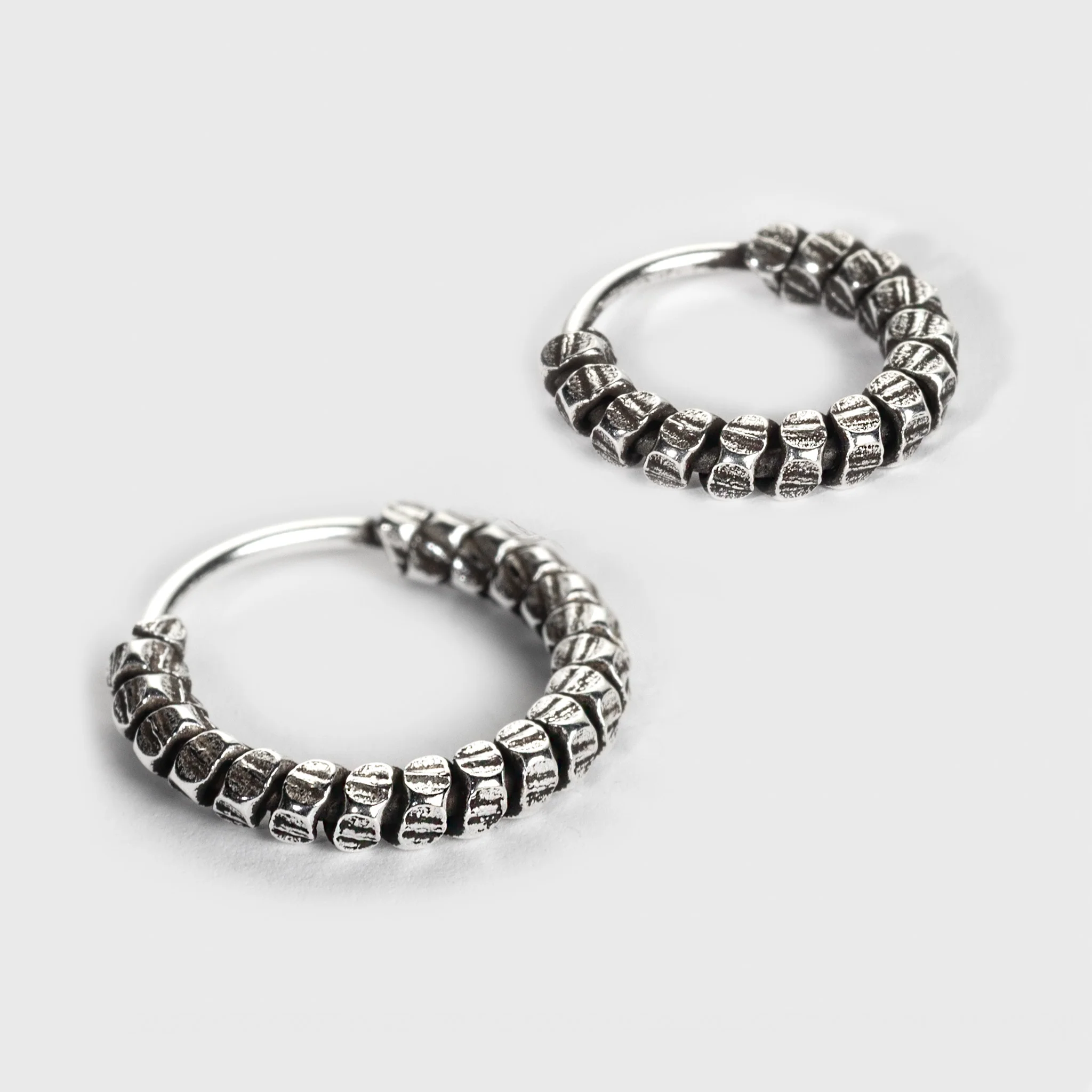 Silver Nose Ring, Segmented Design with an oxidized finish